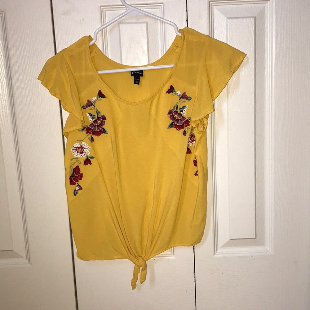 Floral yellow shirt .